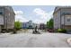 Gated community entrance with manicured landscaping and upscale residential buildings at 1026 Township Sq, Alpharetta, GA 30022