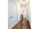 Hallway area with dark wood floors and white painted doors at 1026 Township Sq, Alpharetta, GA 30022