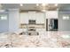 Stylish kitchen with granite countertops, stainless steel appliances, and white cabinetry at 1026 Township Sq, Alpharetta, GA 30022