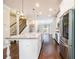 Bright kitchen featuring a large island with granite countertops and stainless steel appliances at 1026 Township Sq, Alpharetta, GA 30022