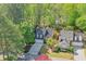 Aerial view of home with well-manicured lawn, mature landscaping, and two-car garage at 1187 Newbridge Ne Trce, Atlanta, GA 30319
