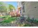 Exterior view of a backyard with a wooden deck, patio set, and well-manicured lawn at 1187 Newbridge Ne Trce, Atlanta, GA 30319