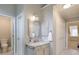 Clean bathroom with marble countertop vanity, mirror, and tiled floors at 1187 Newbridge Ne Trce, Atlanta, GA 30319