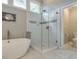 Bright bathroom features a glass shower with white subway tile and tiled floors at 1187 Newbridge Ne Trce, Atlanta, GA 30319