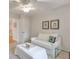 Cozy bedroom features neutral colors, a seating area, and lots of natural light at 1187 Newbridge Ne Trce, Atlanta, GA 30319