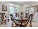 Charming dining room with a round table, classic chairs, and natural light at 1187 Newbridge Ne Trce, Atlanta, GA 30319
