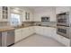 Modern kitchen with white cabinets, stainless steel appliances, and ample counter space at 1187 Newbridge Ne Trce, Atlanta, GA 30319