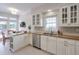 Bright kitchen with white cabinets, stainless steel appliances, and stone countertops at 1187 Newbridge Ne Trce, Atlanta, GA 30319