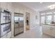 Modern kitchen featuring stainless steel appliances, white cabinets, and a view of the dining area at 1187 Newbridge Ne Trce, Atlanta, GA 30319