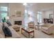 Bright living room with a fireplace, plush seating, and large windows at 1187 Newbridge Ne Trce, Atlanta, GA 30319