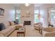 Bright living room with fireplace, large windows, and comfortable seating at 1187 Newbridge Ne Trce, Atlanta, GA 30319