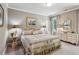 Bright bedroom features neutral paint colors, crown molding and ample natural light from a window at 155 Palmer Oaks Ln, Marietta, GA 30068