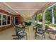 Rear covered patio offers ample seating, ceiling fan, and privacy from the backyard at 155 Palmer Oaks Ln, Marietta, GA 30068