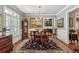 Traditional dining room with hardwood floors, elegant furnishings, and a chandelier, creating a sophisticated ambiance at 155 Palmer Oaks Ln, Marietta, GA 30068