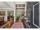Open foyer leading to the living room with hardwood floors, elegant furnishings, and views of the dining area at 155 Palmer Oaks Ln, Marietta, GA 30068