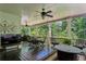 Relaxing outdoor patio featuring ceiling fans and a view of the surrounding greenery at 155 Palmer Oaks Ln, Marietta, GA 30068
