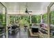 Covered patio with comfortable seating and a view of the wooded backyard at 155 Palmer Oaks Ln, Marietta, GA 30068