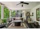 Inviting outdoor patio with comfortable seating and a peaceful wooded view at 155 Palmer Oaks Ln, Marietta, GA 30068