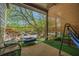 Relaxing balcony featuring a hammock, comfortable chairs, and serene views of lush greenery at 3105 Colonial Way # F, Atlanta, GA 30341
