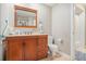 Well-lit bathroom with a wooden vanity, framed mirror, toilet and a shower/tub combo at 3105 Colonial Way # F, Atlanta, GA 30341