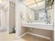 Neutral bathroom with updated marble-look vanity and well lit with modern mirror fixture at 3105 Colonial Way # F, Atlanta, GA 30341