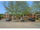 Apartment building with brick facade, mature trees and ample parking in front at 3105 Colonial Way # F, Atlanta, GA 30341