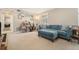 Comfortable living room with a plush blue sofa, neutral walls, and ample natural light at 3105 Colonial Way # F, Atlanta, GA 30341