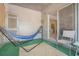Relaxing covered outdoor patio with hammock, rug, and comfortable seating, perfect for enjoying the fresh air at 3105 Colonial Way # F, Atlanta, GA 30341