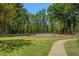 Community tennis court surrounded by lush greenery, perfect for outdoor recreation at 3105 Colonial Way # F, Atlanta, GA 30341