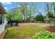 Large backyard featuring a patio, grassy area, and soccer goals perfect for outdoor activities at 5663 Brookstone Nw Dr, Acworth, GA 30101