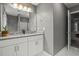 Bathroom featuring dual sinks with granite countertops and white cabinets at 5663 Brookstone Nw Dr, Acworth, GA 30101