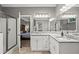 Elegant bathroom featuring granite countertops, dual sinks, and a glass-enclosed shower at 5663 Brookstone Nw Dr, Acworth, GA 30101