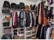 Walk-in closet with ample storage space, shelving, and organization for clothes and accessories at 5663 Brookstone Nw Dr, Acworth, GA 30101
