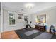 Bright exercise room with a stationary bike, hardwood floors, and natural light from multiple windows at 5663 Brookstone Nw Dr, Acworth, GA 30101