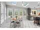 Eat-in kitchen area featuring large windows, stainless steel appliances, and modern cabinetry at 5663 Brookstone Nw Dr, Acworth, GA 30101