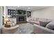 Inviting living room with a cozy fireplace, built-in bookshelves, and comfortable seating for relaxing and entertaining at 5663 Brookstone Nw Dr, Acworth, GA 30101