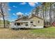Spacious backyard with a camper parked next to a tan home and an adjacent shed at 150 Burke St Ne, Marietta, GA 30060