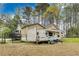 Backyard featuring a camper parked next to a tan house and a fenced-in deck area at 150 Burke St Ne, Marietta, GA 30060