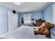 Bedroom features pale blue walls, a large window, double door closet, and a cozy, relaxing atmosphere at 150 Burke St Ne, Marietta, GA 30060