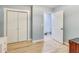 Bedroom featuring pale blue walls, light hardwood floors, and closet storage space at 150 Burke St Ne, Marietta, GA 30060