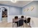 Cozy dining area featuring modern lighting, seating for four, and access to other parts of the house at 150 Burke St Ne, Marietta, GA 30060