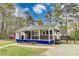 Charming single-story home featuring a quaint front porch, side patio, and a beautifully landscaped yard at 150 Burke St Ne, Marietta, GA 30060
