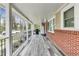 Spacious porch featuring ample room for outdoor entertaining, with a grill and mini-fridge included at 150 Burke St Ne, Marietta, GA 30060
