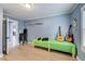 Flex space with a closet, guitars, bench, and light wood floors for use as an office, bedroom, or gym at 150 Burke St Ne, Marietta, GA 30060