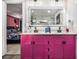 Bathroom features a dual sink vanity with bright cabinets and a shower at 196 Wadley Nw St, Atlanta, GA 30314