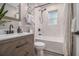 Bathroom features a shower over tub, contemporary vanity with modern fixtures at 196 Wadley Nw St, Atlanta, GA 30314