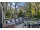 Outdoor deck features comfortable seating and mature trees, perfect for entertaining at 196 Wadley Nw St, Atlanta, GA 30314