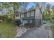 Split-level home featuring a driveway and gray-painted brick foundation at 196 Wadley Nw St, Atlanta, GA 30314