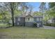 Charming split-level home with gray siding, brick foundation, and a welcoming front porch at 196 Wadley Nw St, Atlanta, GA 30314