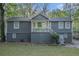 Charming split-level home with painted brick foundation, welcoming porch, and well-maintained landscaping at 196 Wadley Nw St, Atlanta, GA 30314